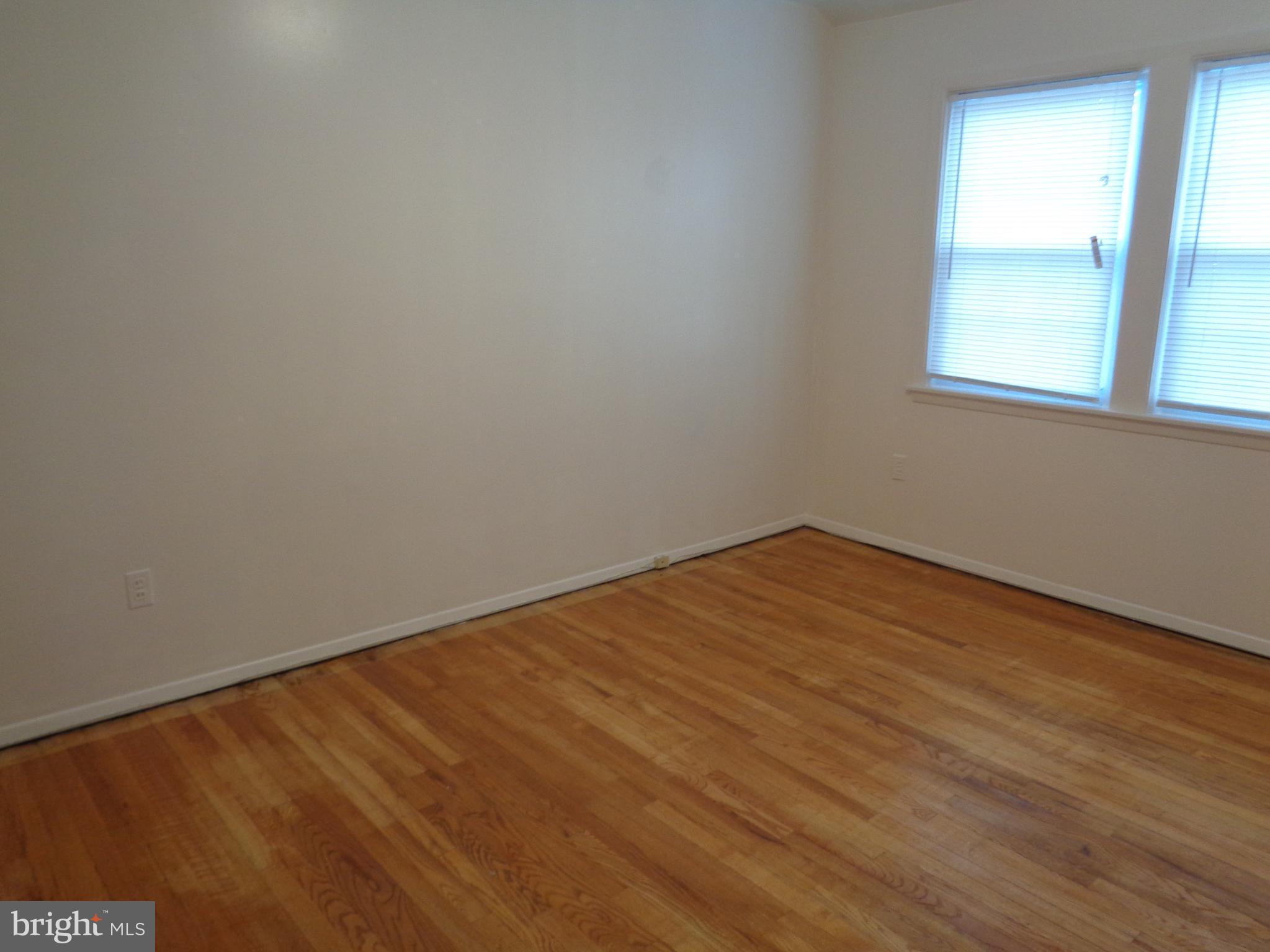6213 Marlora Road Baltimore, MD 21239 - Photo 10 of 26 an empty room with a window