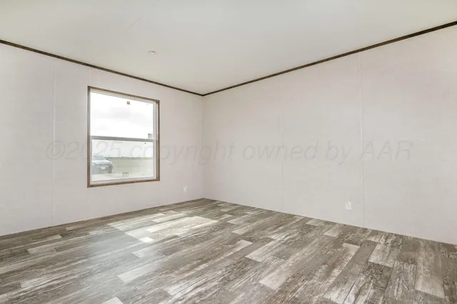 a view of a room with wooden floor