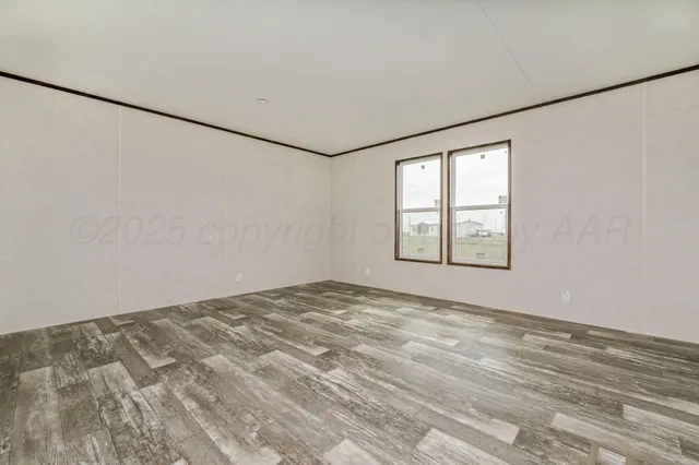 a bathroom with a granite countertop sink mirror vanity and toilet