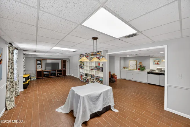a bedroom with furniture and a chandelier