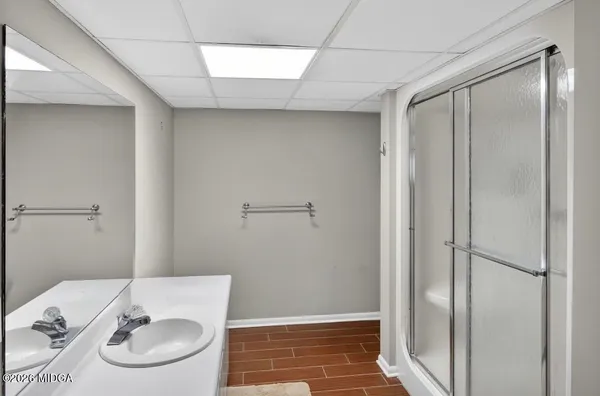 a bathroom with a sink and a mirror