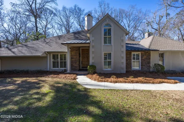 a front view of a house with yard