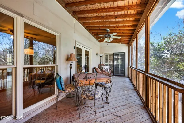 a outdoor space with wooden floor and furniture