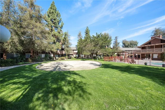 a view of a house with a backyard porch and sitting area