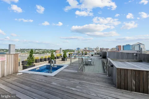 a view of roof deck with patio