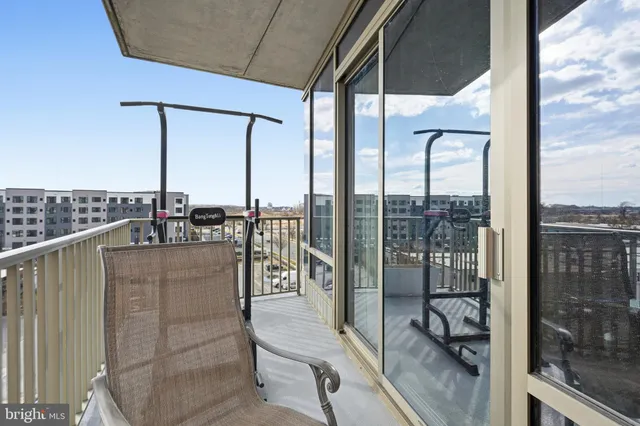 a view of a balcony with chairs