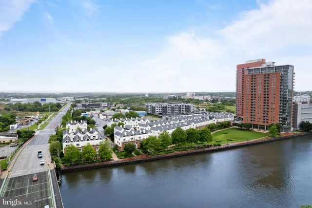 an aerial view of a city with lake view