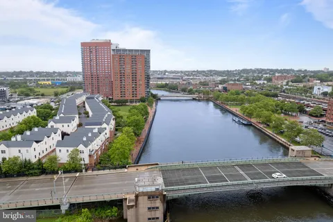 an aerial view of a city with lawn chairs