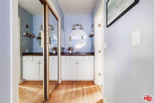 a bathroom with a shower and a sink