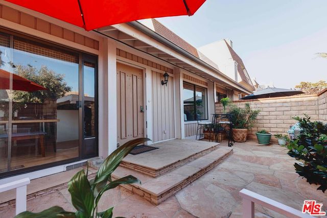 a backyard of a house with seating space