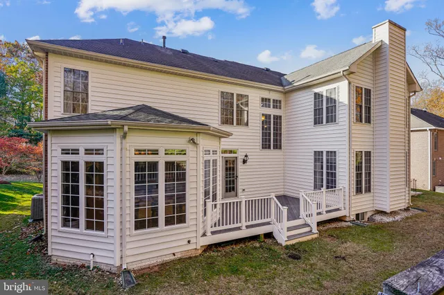 a dining room with furniture window and wooden floor