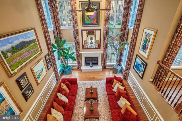 a view of entryway and hall with wooden floor and a front door