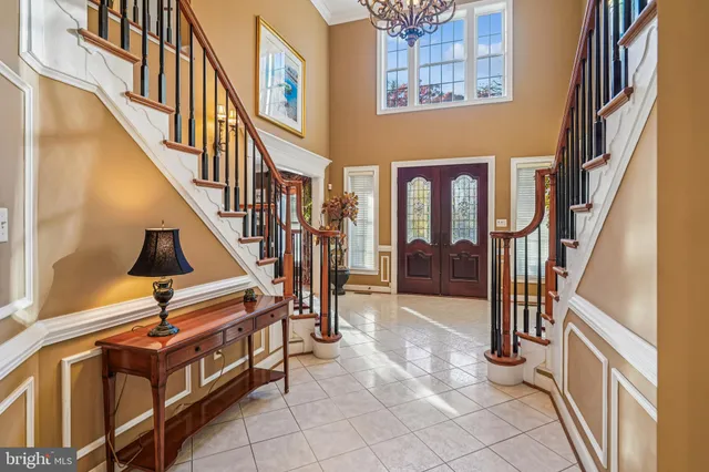 a spacious bathroom with a tub sink and mirror