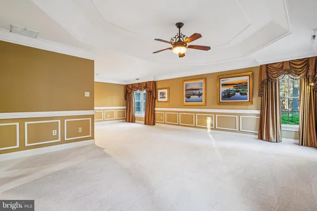 a view of a dinning room with a table and chairs