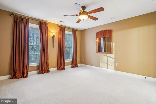 an entryway with wooden floor and stairs