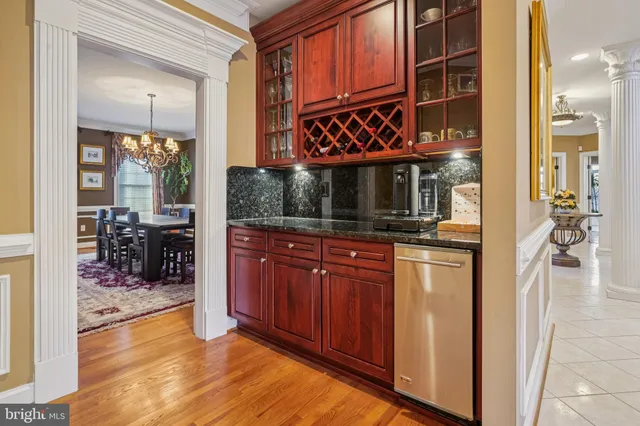 a view of a room with wooden floor and large window