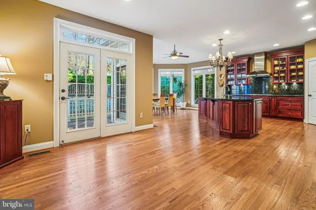 a view of a house with a wooden deck