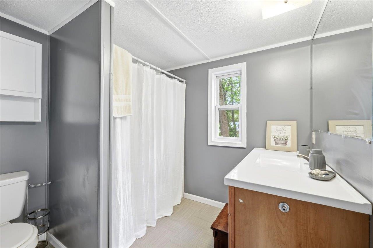 406 Trayfoot Road Grottoes, VA 24441 - Photo 16 of 30 a room with a sink a toilet and a window