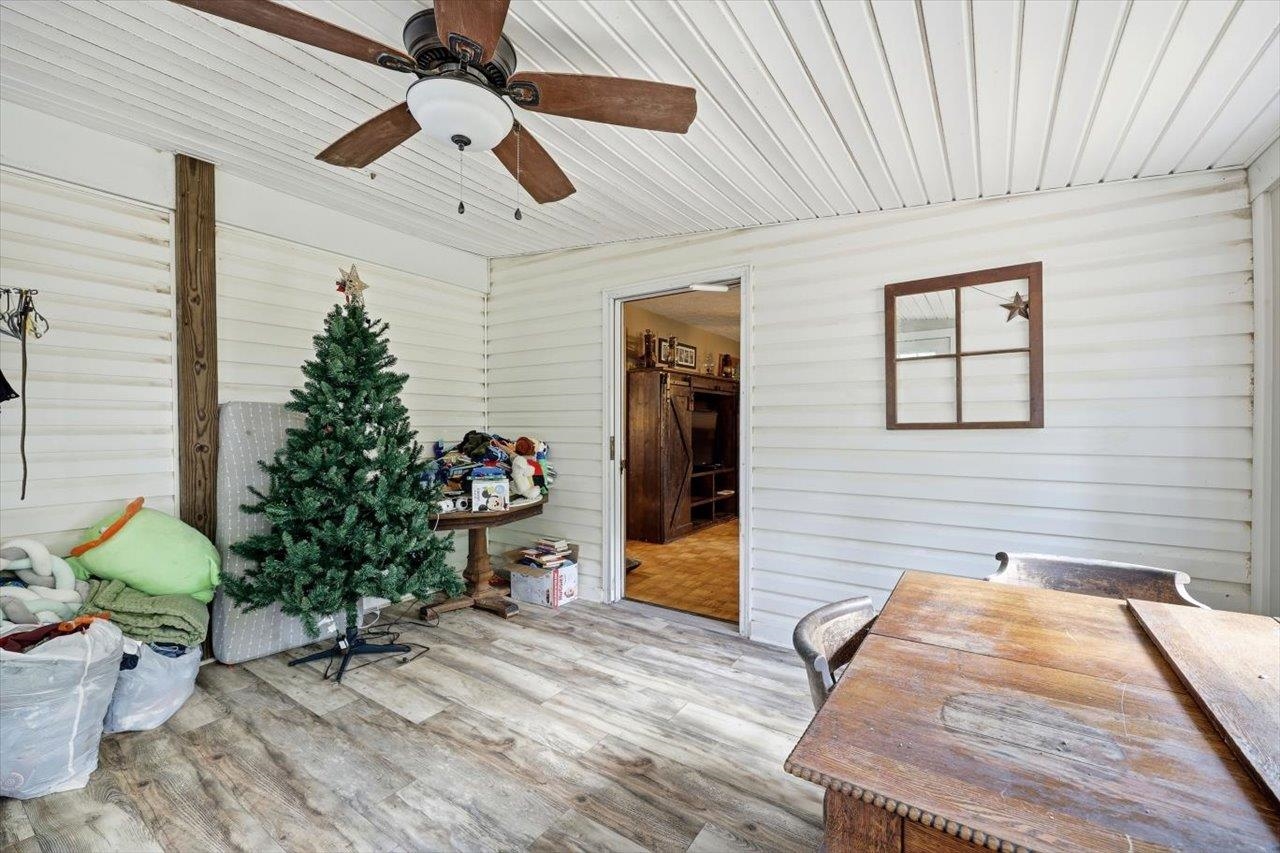 406 Trayfoot Road Grottoes, VA 24441 - Photo 20 of 30 a hallway with wooden floor and a potted plant