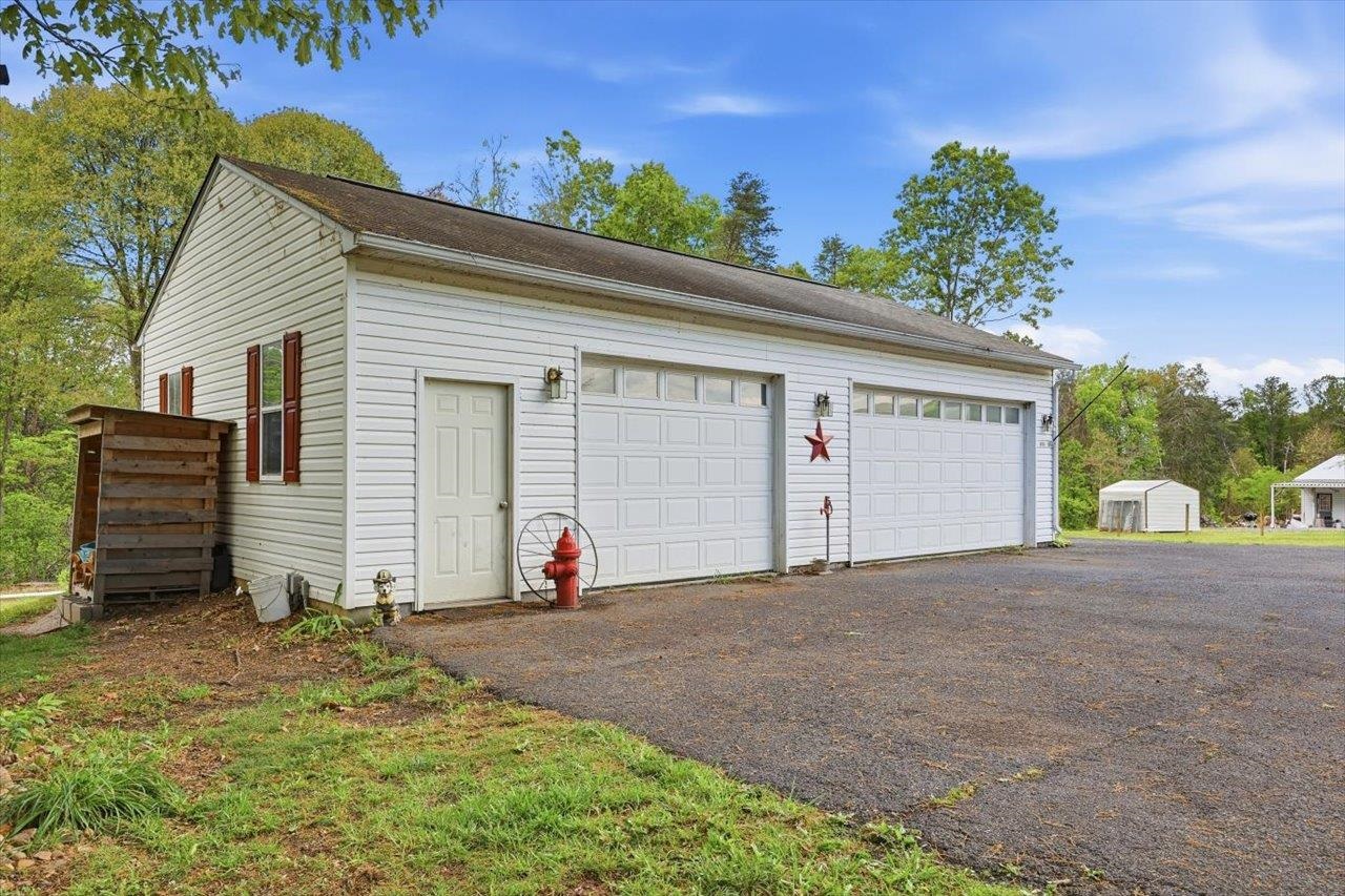 406 Trayfoot Road Grottoes, VA 24441 - Photo 29 of 30 a view of a house with backyard and a garage