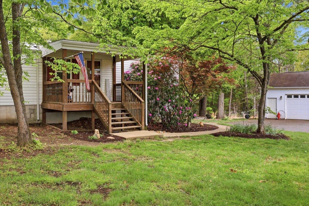 406 Trayfoot Road Grottoes, VA 24441 - Photo 3 of 30 a view of a chair and table in the yard in front of house