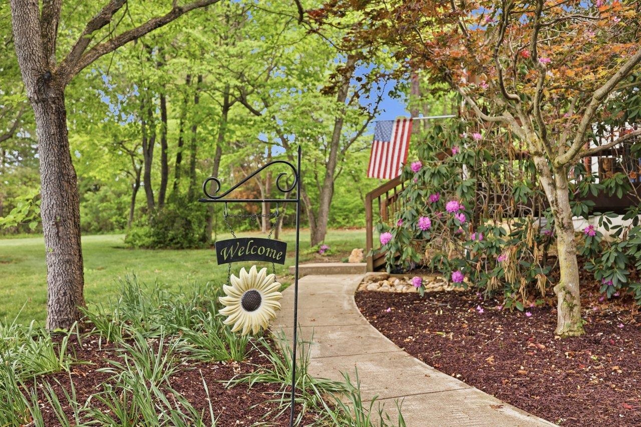 406 Trayfoot Road Grottoes, VA 24441 - Photo 4 of 30 a garden with flowers and trees