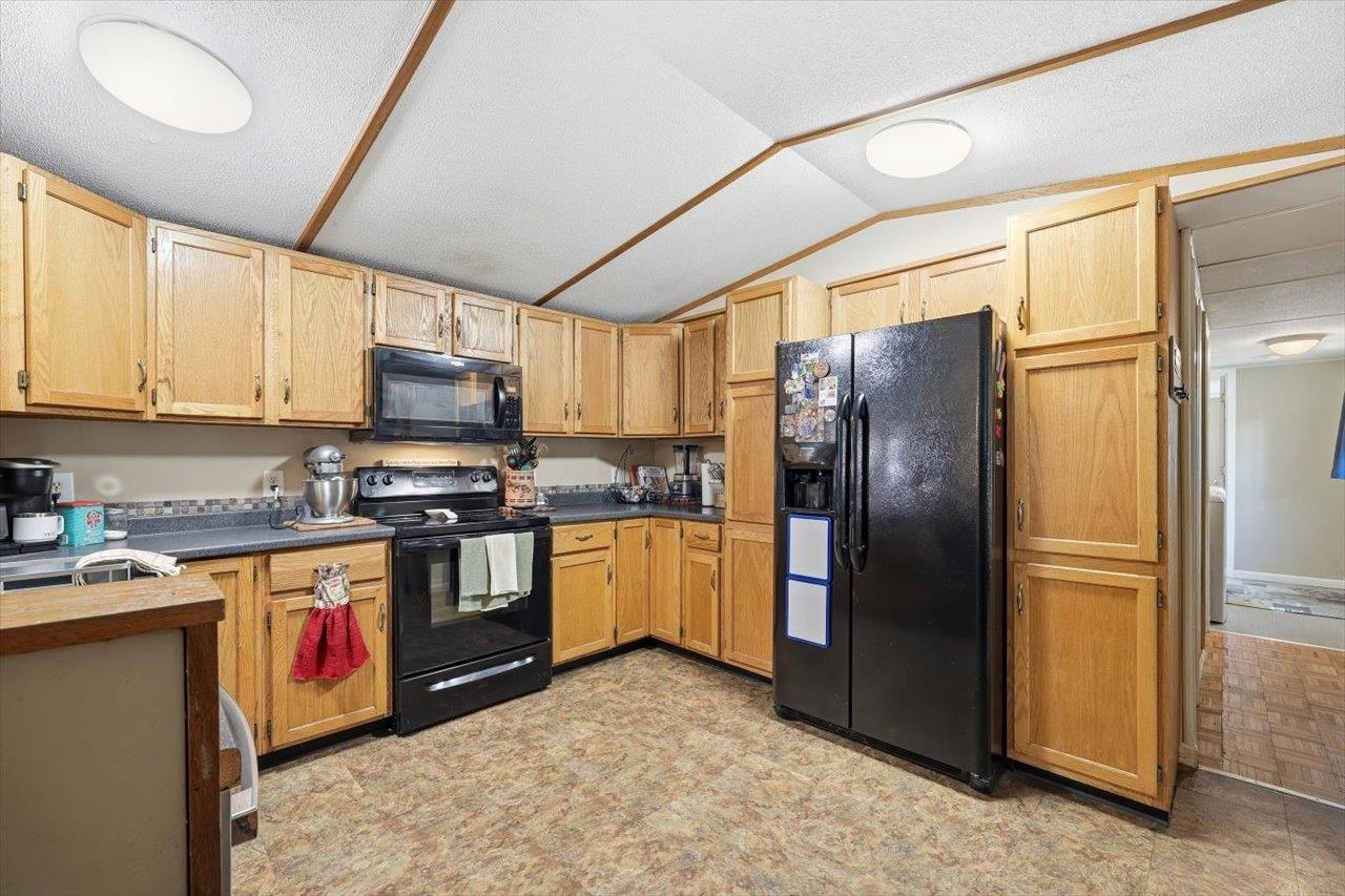 406 Trayfoot Road Grottoes, VA 24441 - Photo 7 of 30 a kitchen with stainless steel appliances granite countertop a refrigerator a stove top oven a sink and dishwasher