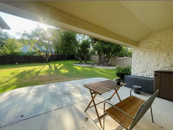 a view of a backyard with a small house
