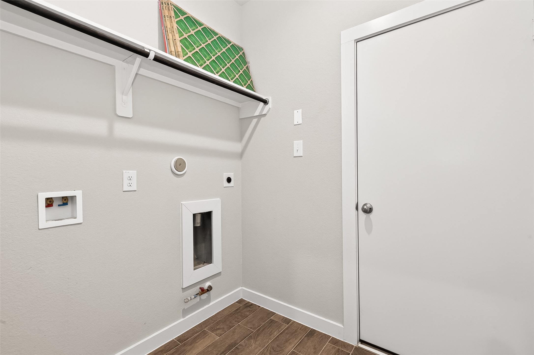 2142 Reed Cave Lane Spring, TX 77386 - Photo 23 of 50 a view of a hallway with wooden floor and a bathroom