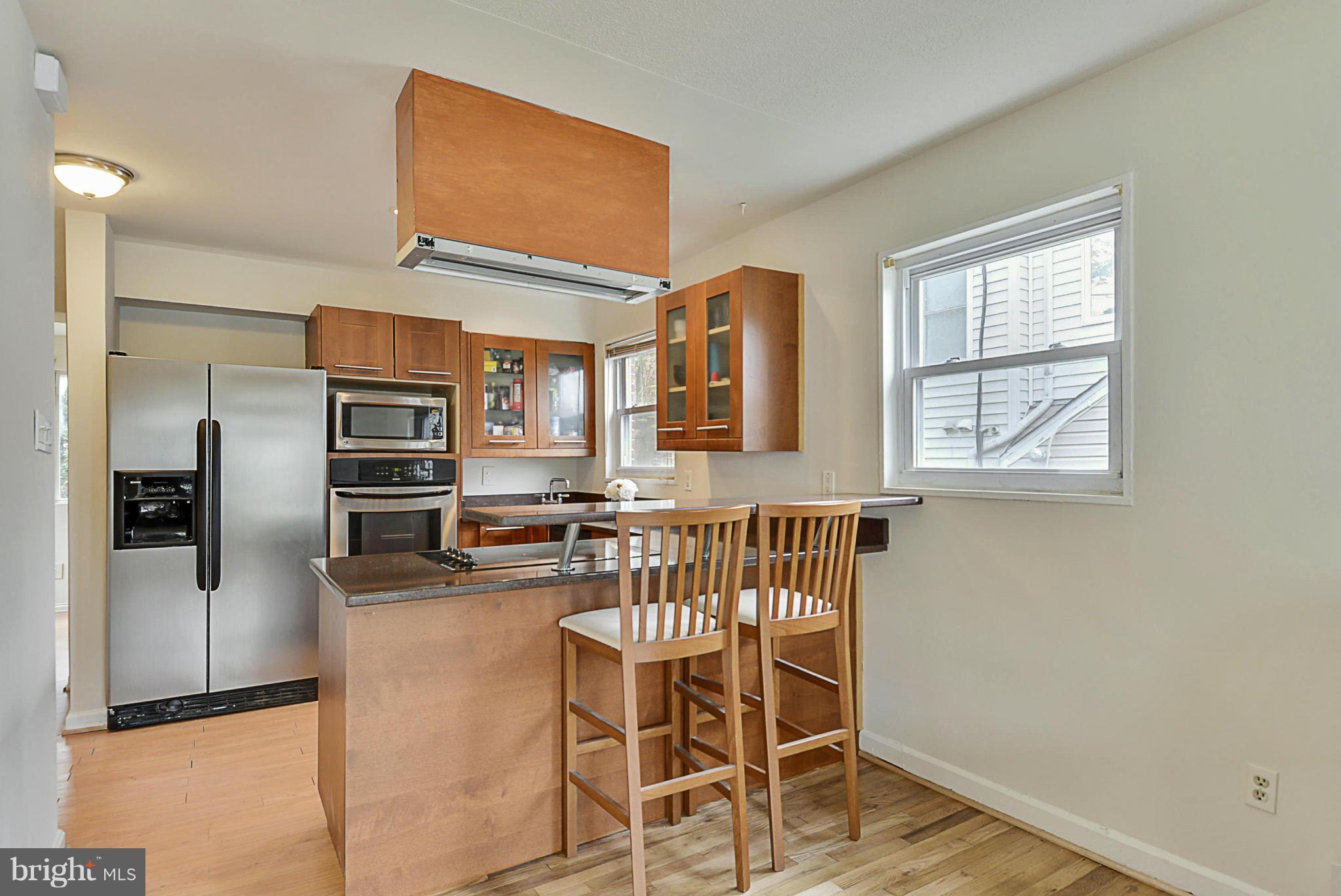 2800 Denley Place Silver Spring, MD 20906 - Photo 4 of 26 a kitchen with stainless steel appliances a refrigerator and a stove top oven