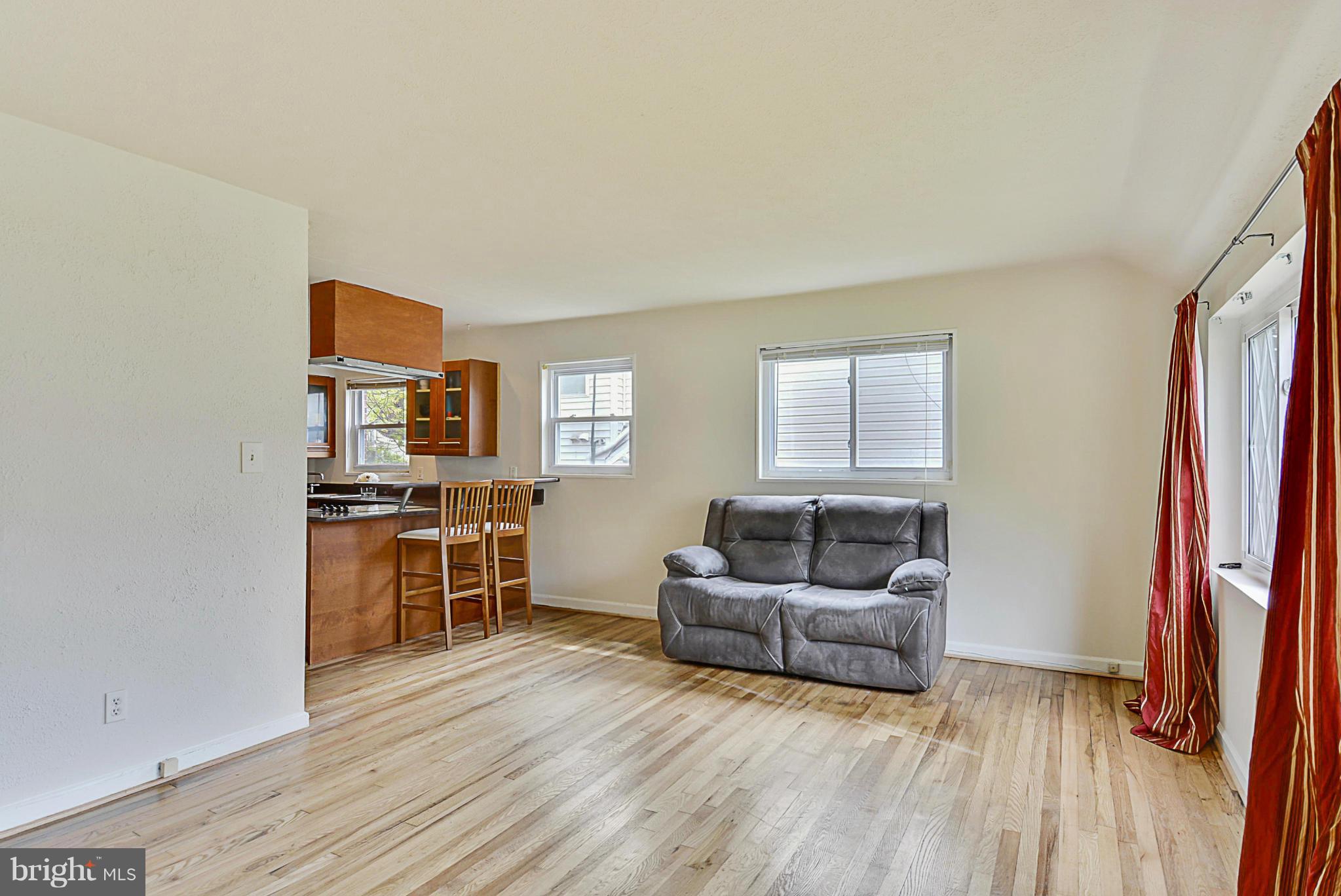 2800 Denley Place Silver Spring, MD 20906 - Photo 6 of 26 a living room with furniture and a flat screen tv