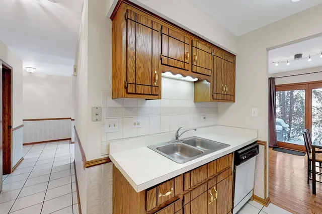 a kitchen that has a sink and a stove in it