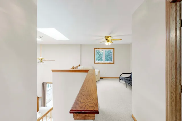 a view of a room with wooden floor and table
