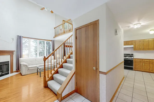 a view of a living room with furniture and a flat screen tv