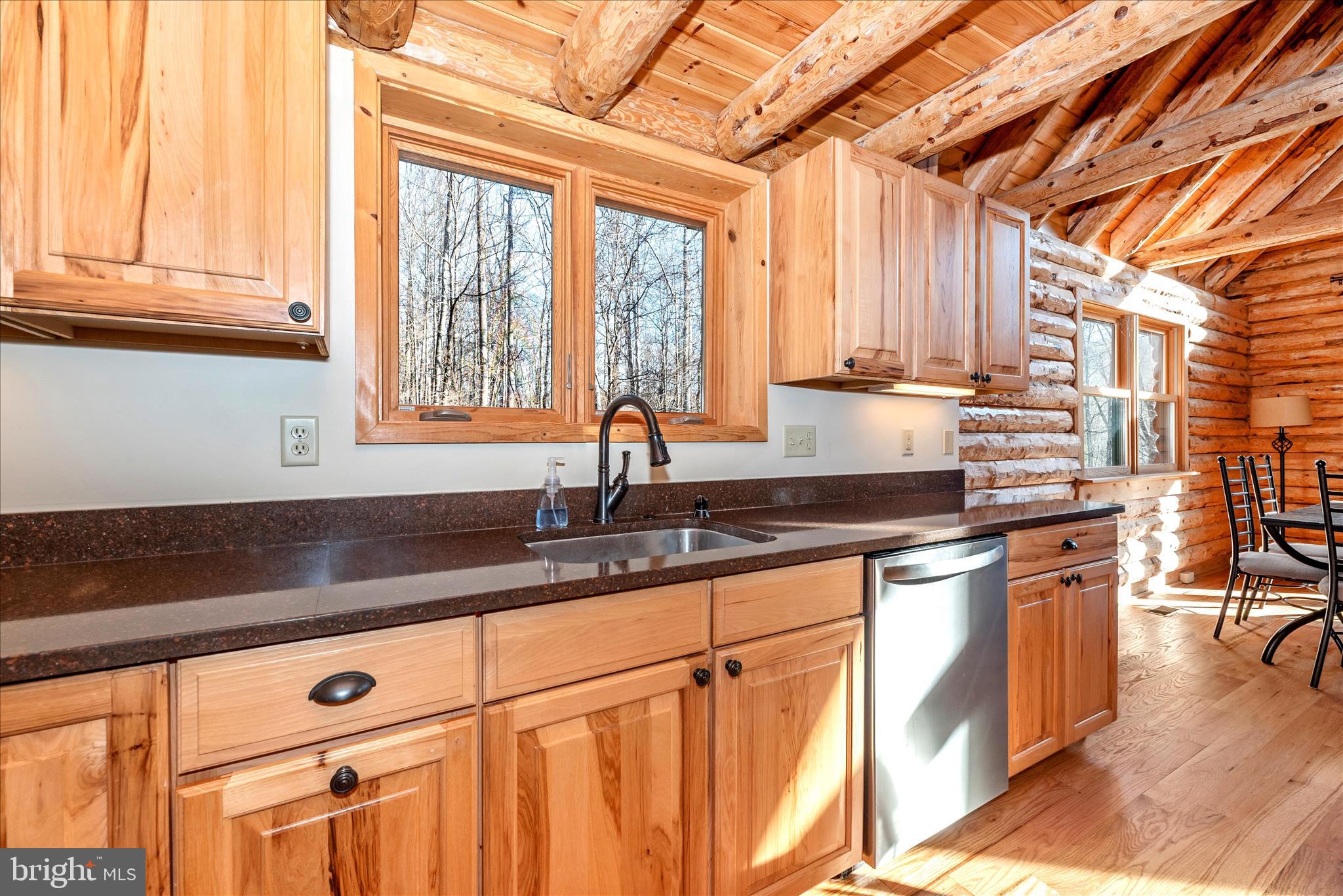 12804 Spruce Run Road Myersville, MD 21773 - Photo 17 of 72 a kitchen with stainless steel appliances granite countertop a sink a stove and cabinets