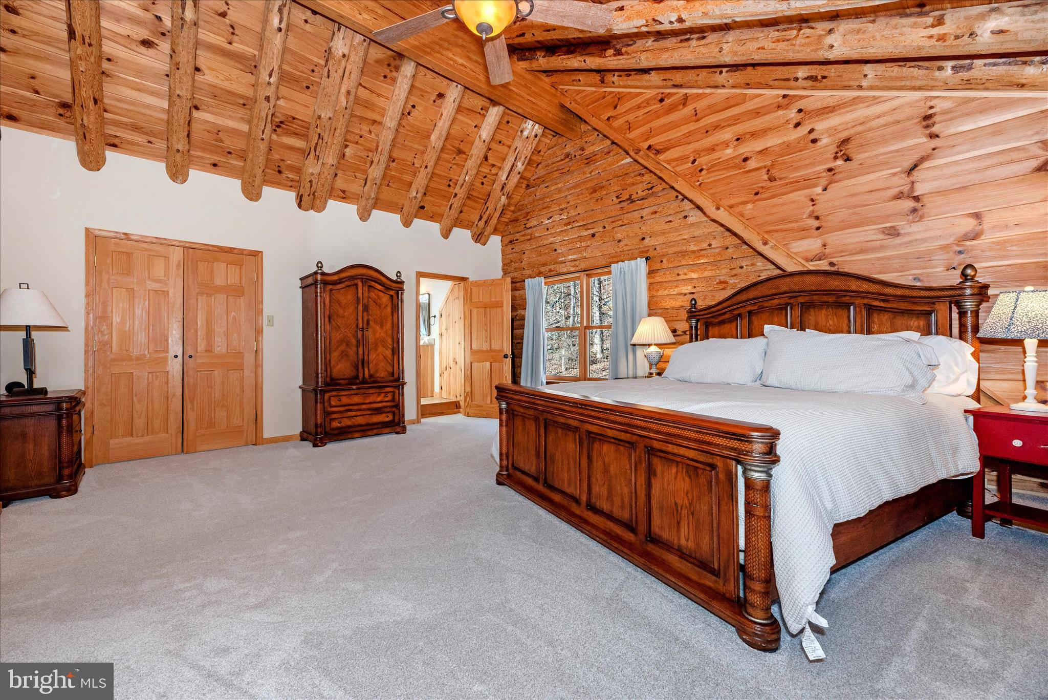 12804 Spruce Run Road Myersville, MD 21773 - Photo 21 of 72 a spacious bedroom with a bed and a table in it