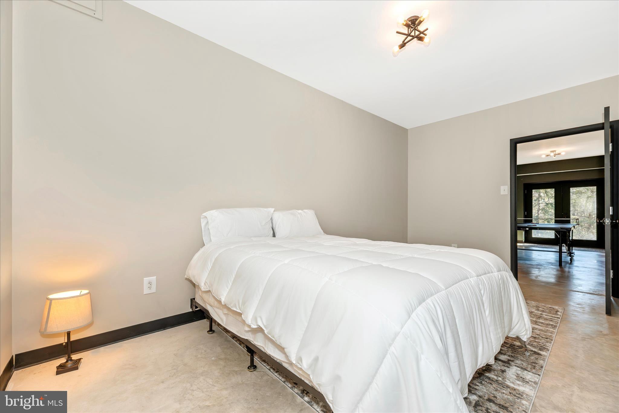 12804 Spruce Run Road Myersville, MD 21773 - Photo 31 of 72 a large bed sitting in a bedroom next to a window