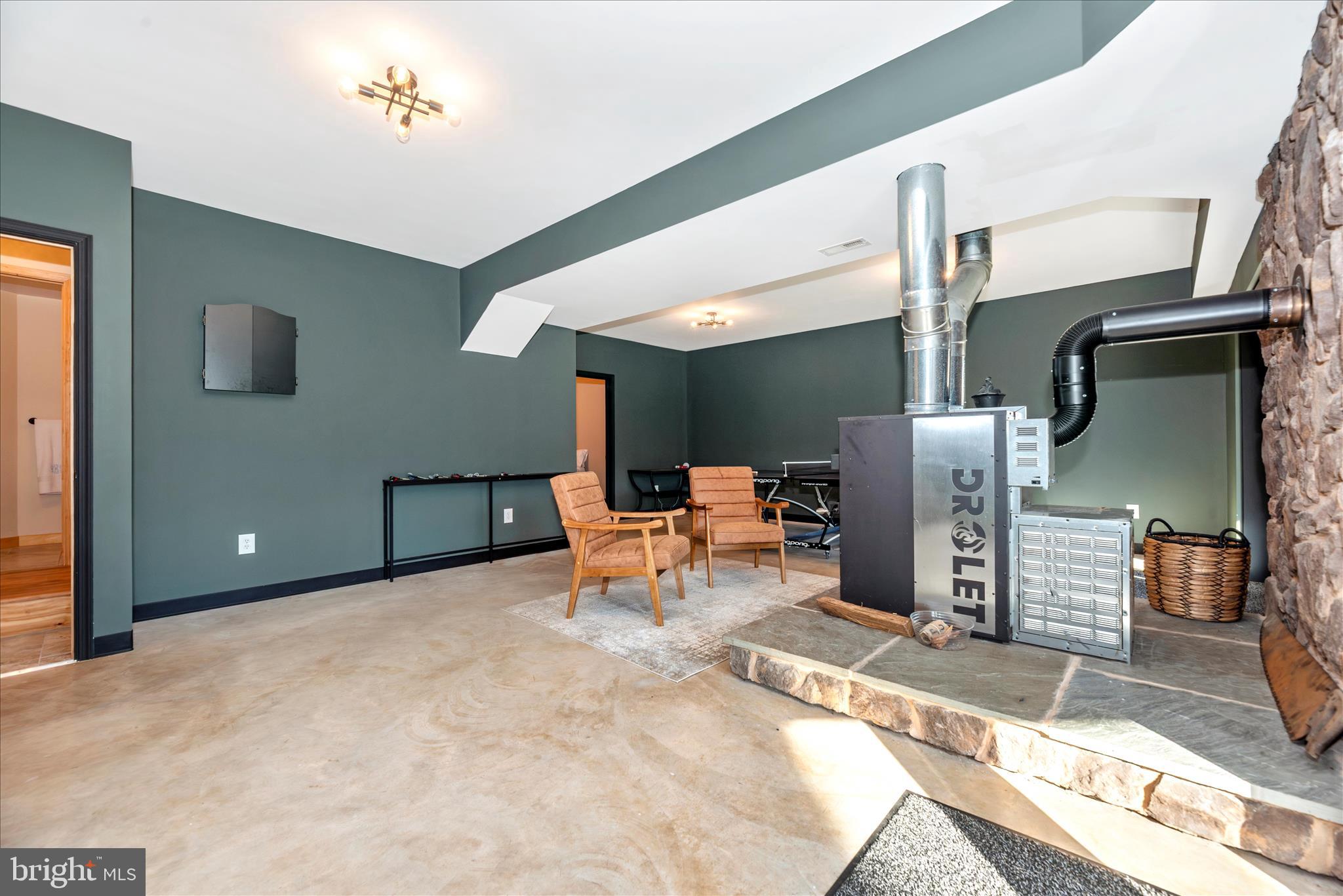 12804 Spruce Run Road Myersville, MD 21773 - Photo 35 of 72 a living room with furniture and a rug