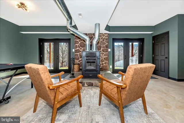 a view of a swimming pool with an outdoor space and seating area