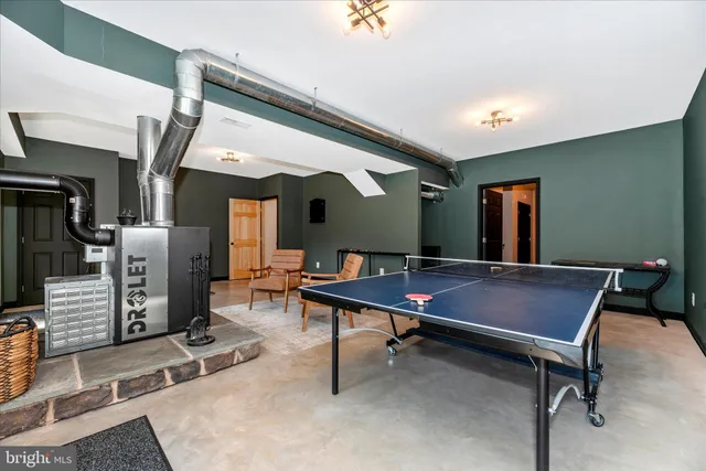 a big yard with trees in the background