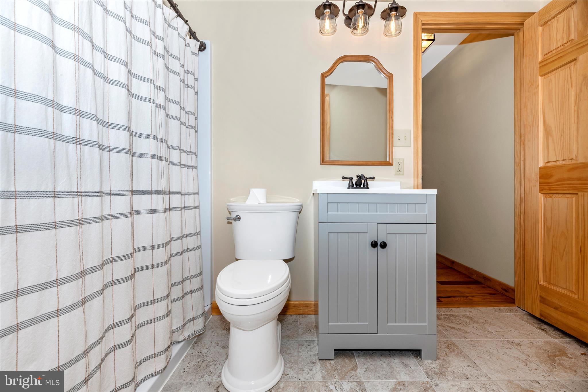 12804 Spruce Run Road Myersville, MD 21773 - Photo 38 of 72 a bathroom with a sink toilet and shower