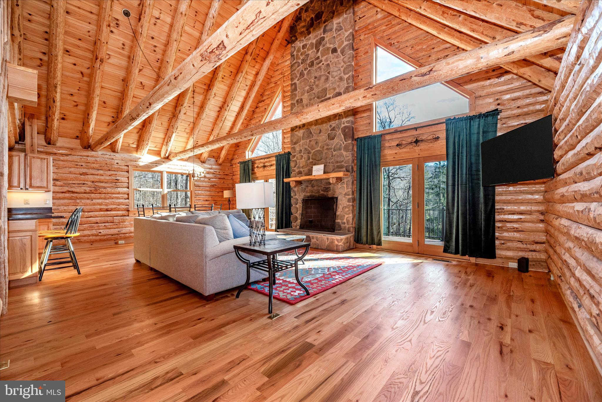 12804 Spruce Run Road Myersville, MD 21773 - Photo 4 of 72 a living room with patio furniture and wooden floor