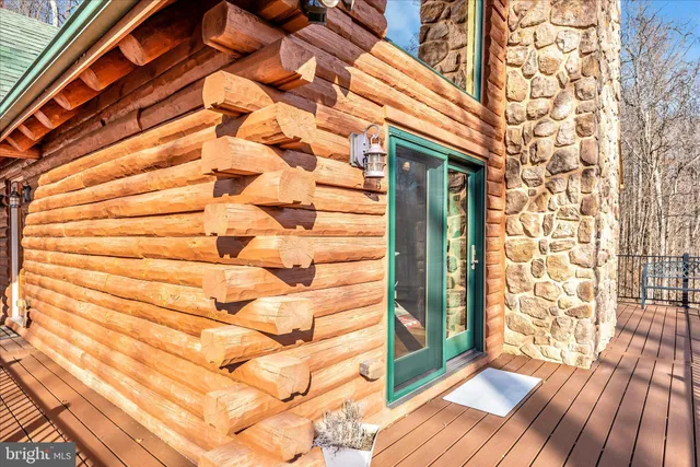 a view of a dry yard with mountains in the background