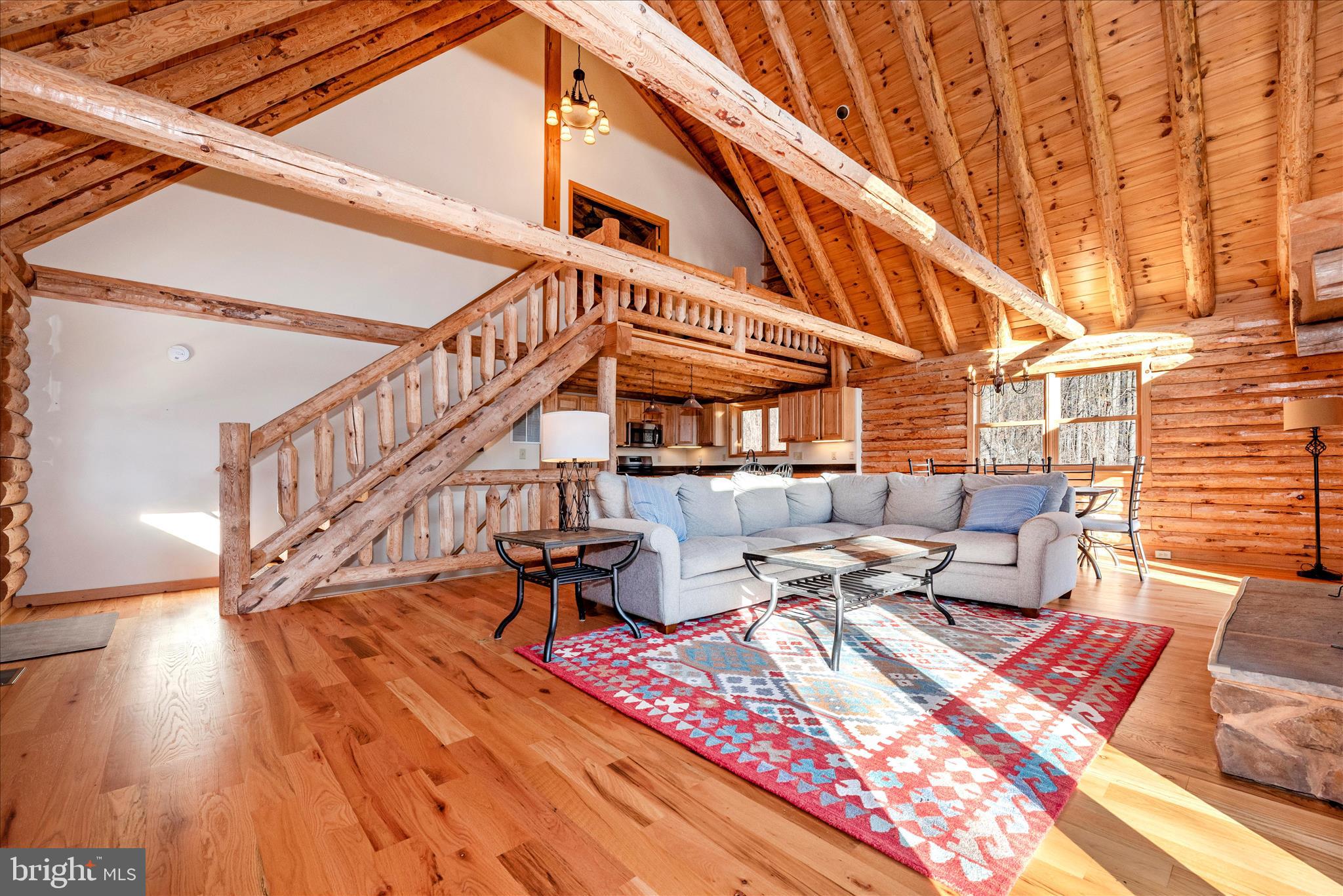 12804 Spruce Run Road Myersville, MD 21773 - Photo 5 of 72 a view of a patio with couches and table potted plants with wooden floor