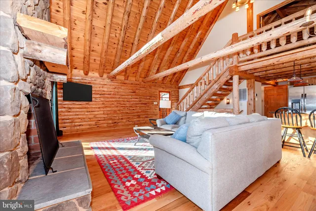 a balcony with table and chairs