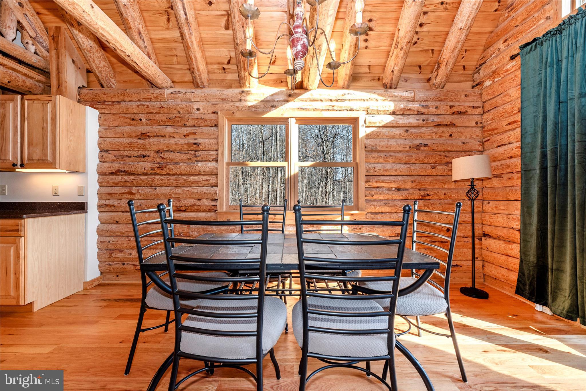 12804 Spruce Run Road Myersville, MD 21773 - Photo 9 of 72 a balcony with table and chairs