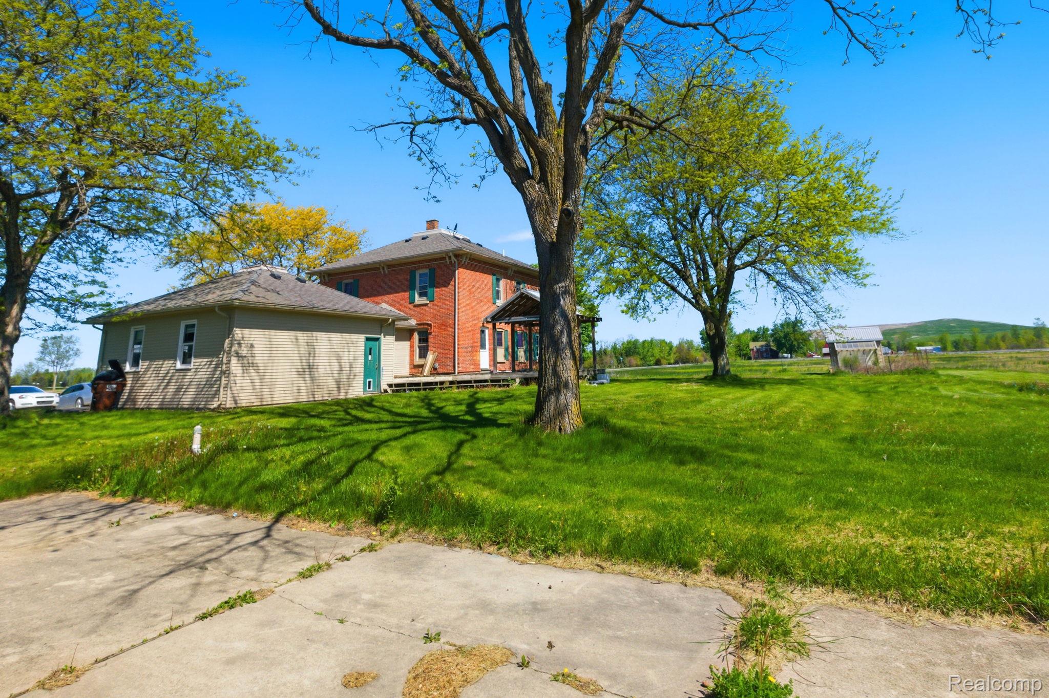 14104 Carleton West Road Carleton, MI 48117 - Photo 42 of 58 View of green lawn with a gazebo