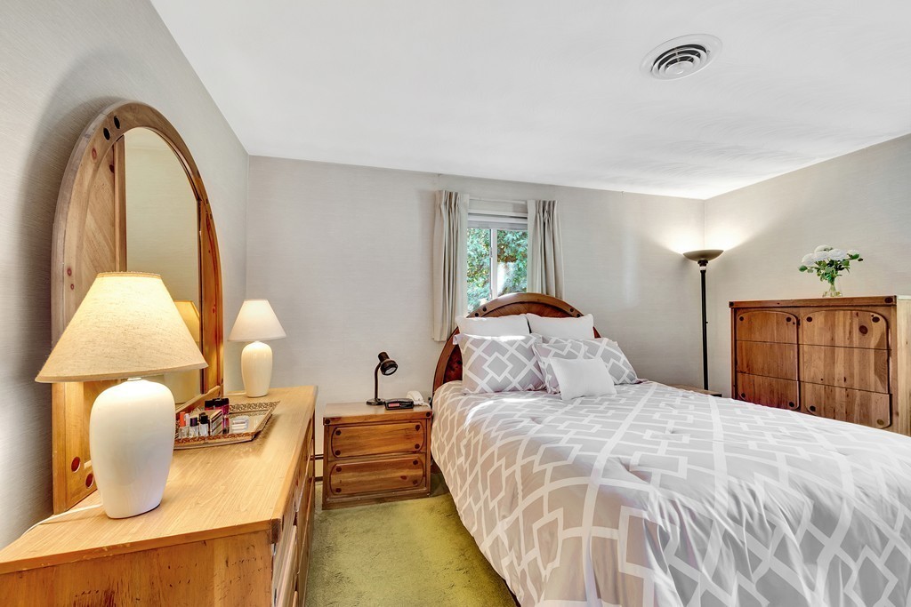 14 Clara Road Framingham, MA 01701 - Photo 8 of 11 a bedroom with bed and a window