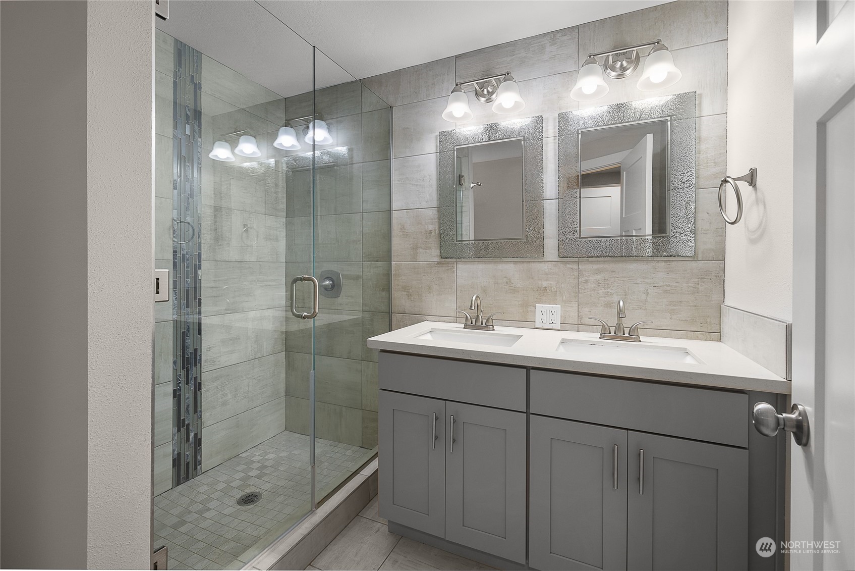 9512 Edmonds Way Edmonds, WA 98020 - Photo 13 of 24 a bathroom with a shower sink and mirror