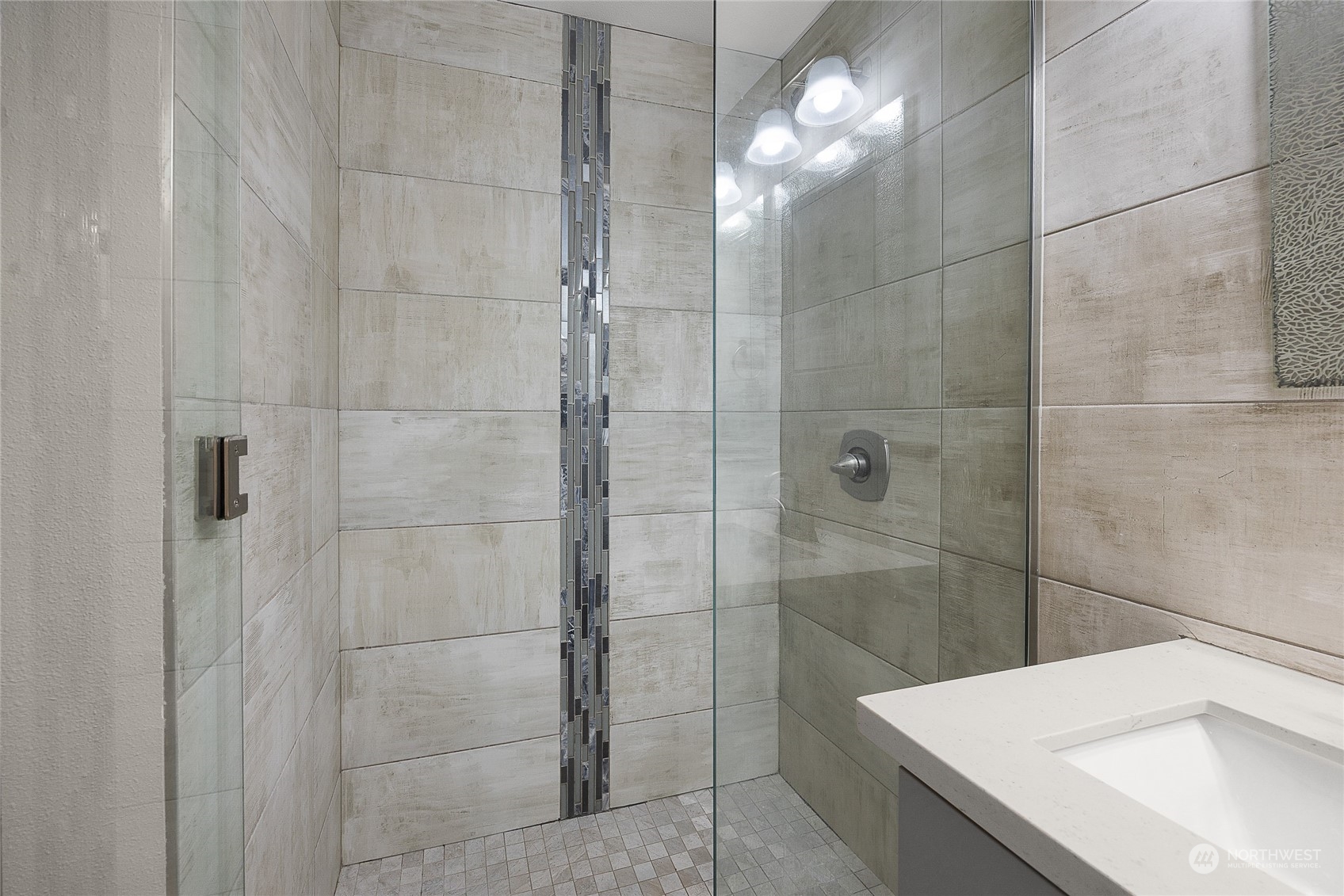 9512 Edmonds Way Edmonds, WA 98020 - Photo 14 of 24 a bathroom with a sink and a shower